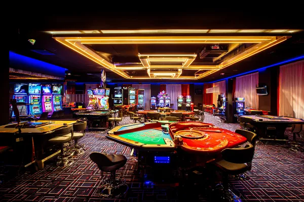 88FD Mobile Casino — Play anytime, anywhere A player using their smartphone during a festive local event, representing 88FD’s fully mobile-friendly casino.